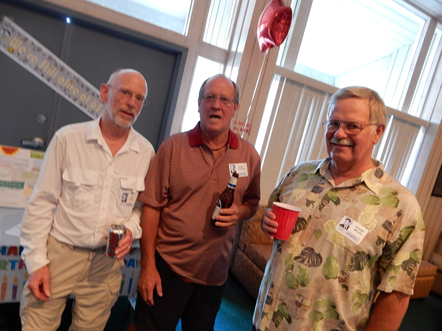 Bob Busch, Brad Jackson and Steve Miller update each other at the 65th Birthday Party